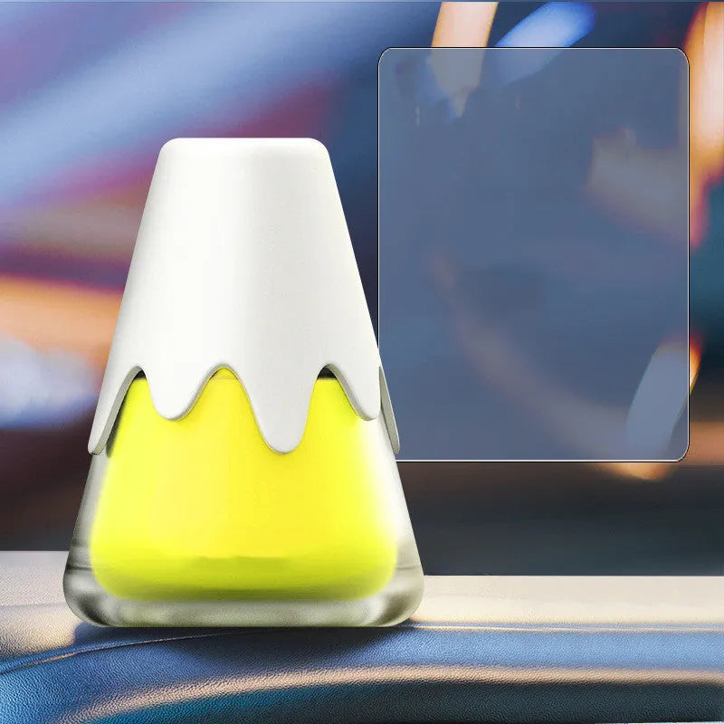 Glass jar car air freshener in choice of scents on a car dashboard.