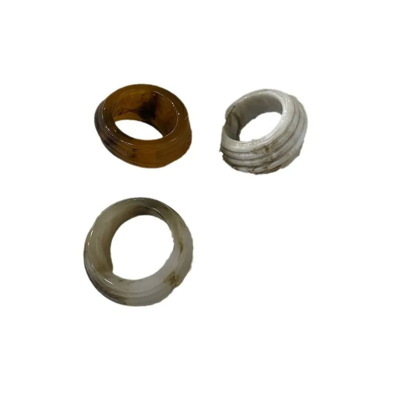 Chinese style resin ring with geometry shape and irregular width in brown or white.