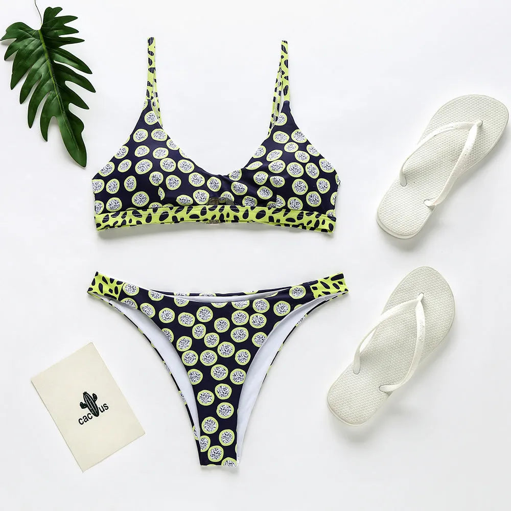 Women's black and white dot and red and white stripe polyester bikini swimsuit set on a mannequin.
