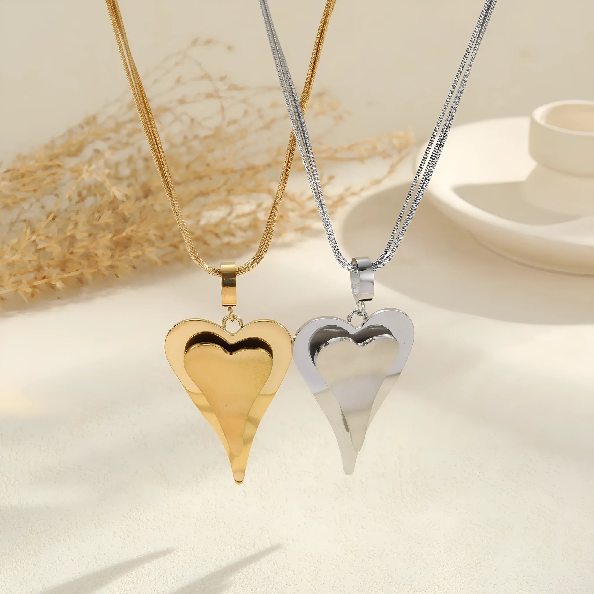 Stainless steel double heart snake bones chain necklace with geometric pendant in gold or steel colour