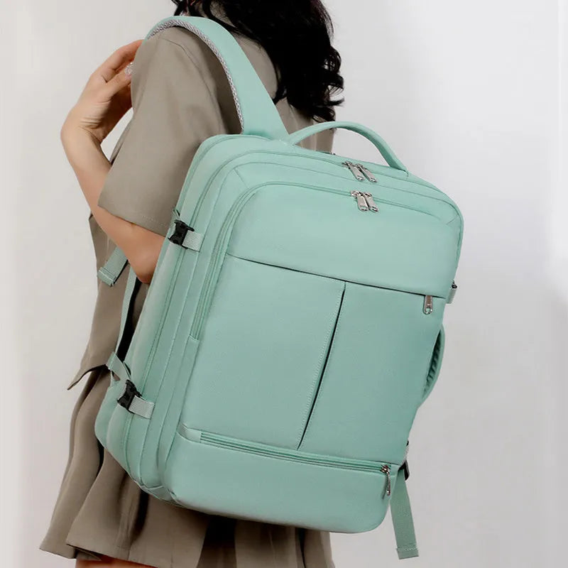 Waterproof oxford cloth backpack showing multiple pockets and zippers with 15.6 inch laptop compartment