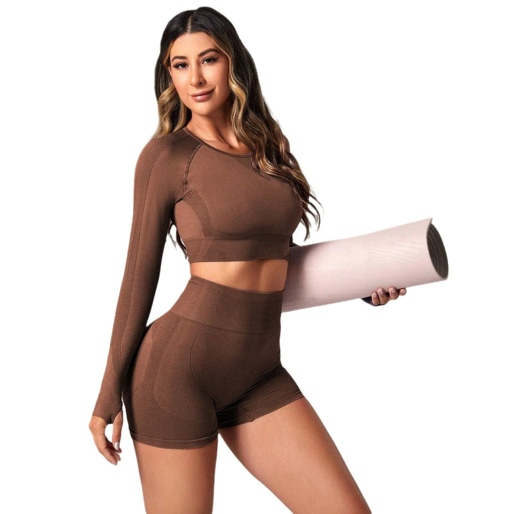 Women's black yoga suit with high waist pants and long sleeve pullover top for yoga practice