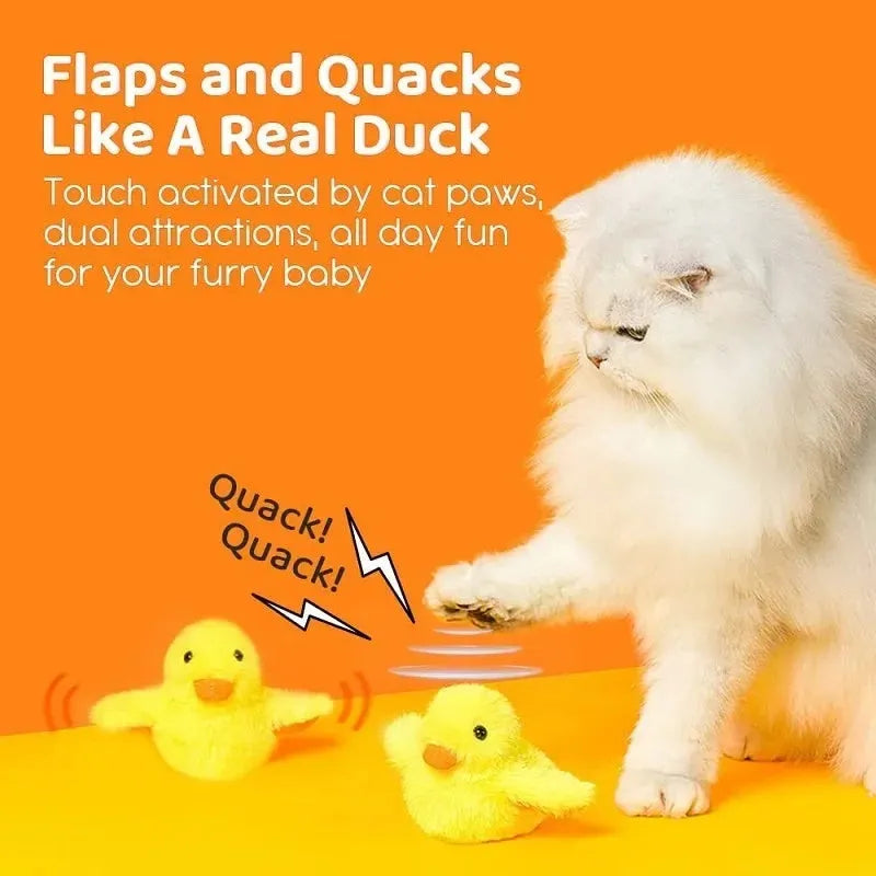 Yellow chick-shaped electric interactive cat toy with plush cover on a plain background.