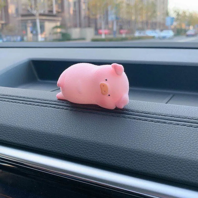 Cartoon pig character resin car ornament for dashboard or windscreen decoration.