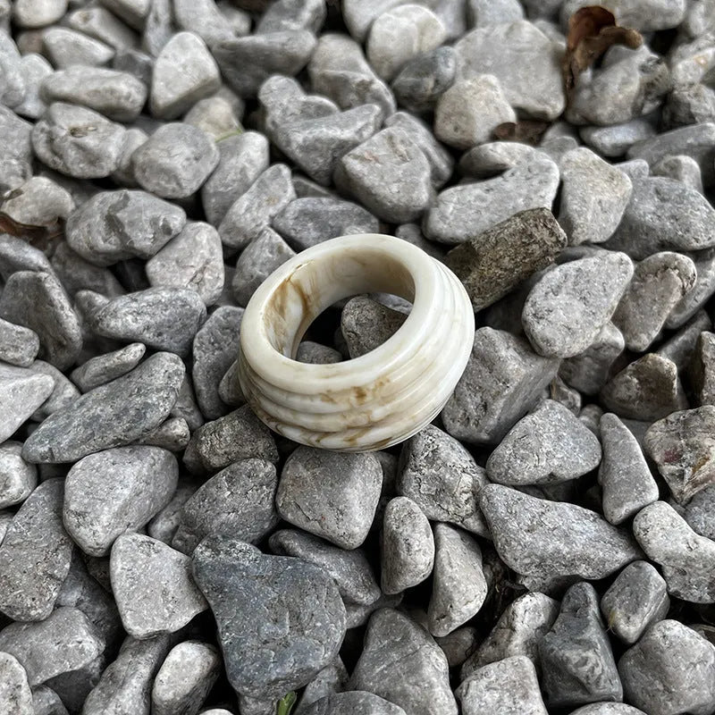 Chinese style resin ring with geometry shape and irregular width in brown or white.