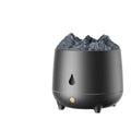 White volcano-shaped humidifier with flaming mountain design on wooden surface