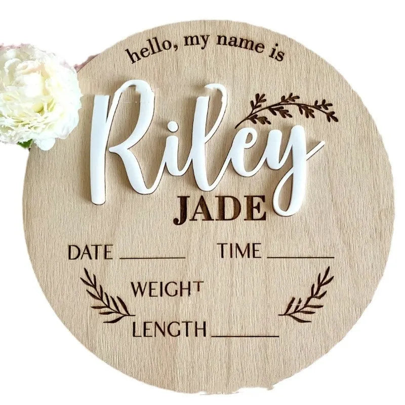 Square wooden baby name sign with birth information, 15 cm wide, in one of three style variants.