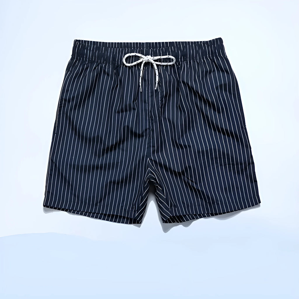 Polyester fibre striped beach shorts in navy blue with straight leg opening