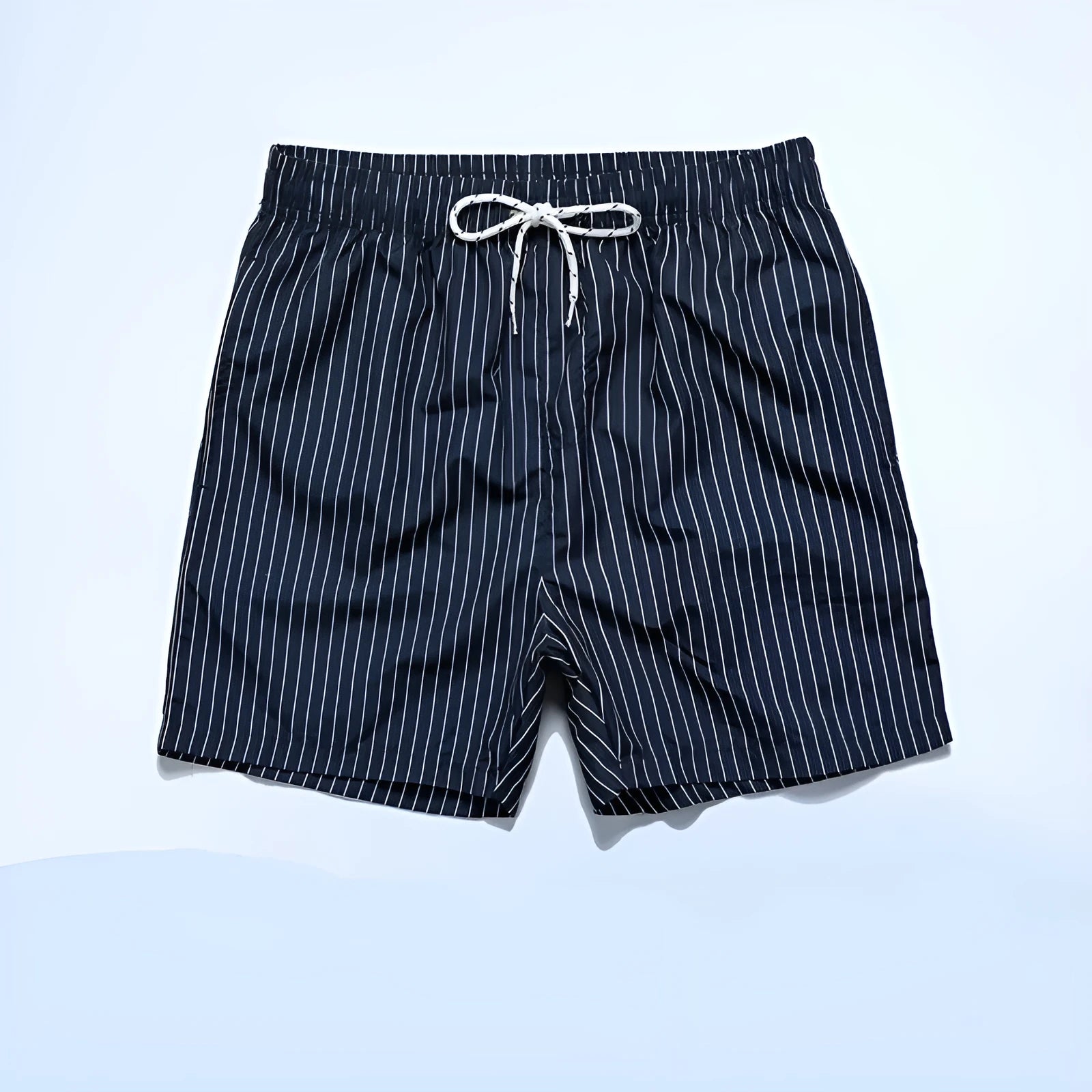 Polyester fibre striped beach shorts in navy blue with straight leg opening