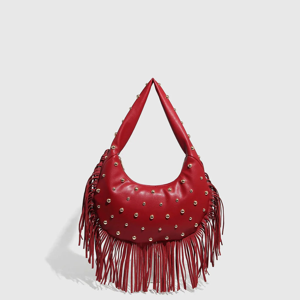 Retro black tassel shoulder handbag showing internal mobile phone pocket and decorative tassel detail.