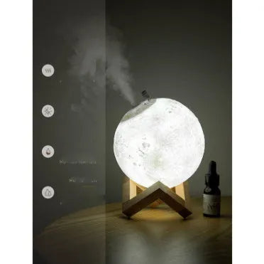Spherical moon humidifier with LED night light on a bedside table, showing USB charging cable
