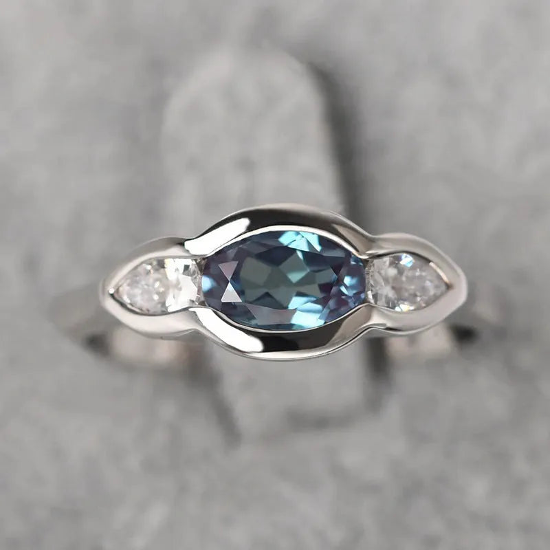 Geometric ellipse women's ring with inlaid zircon stone in white gold plating