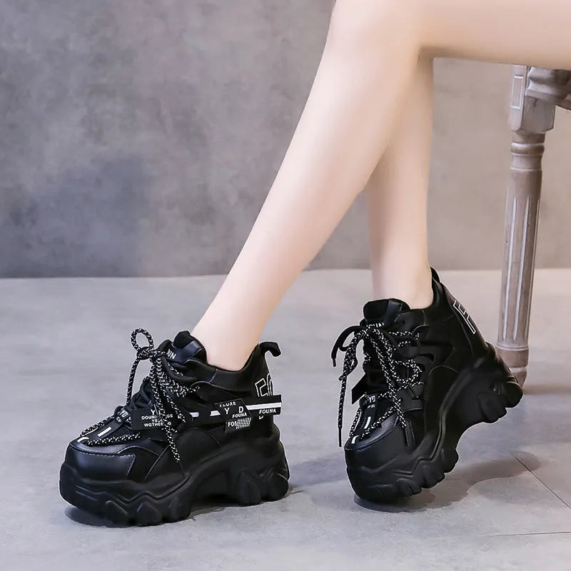 Women's white and black mesh platform sports shoes with cross-strap design and rubber sole