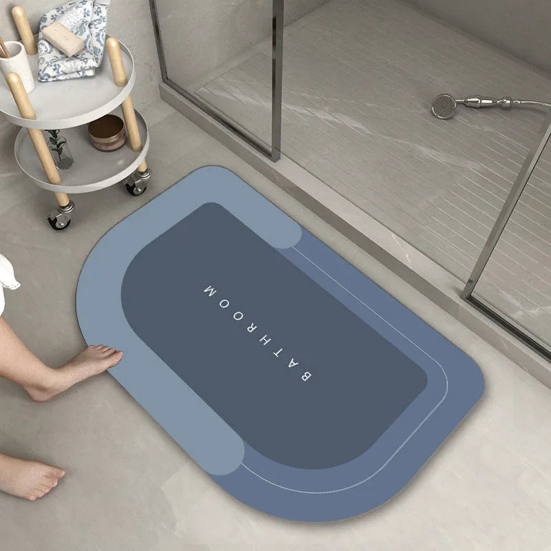 Cushioned blue oval bathroom floor mat on tiled flooring