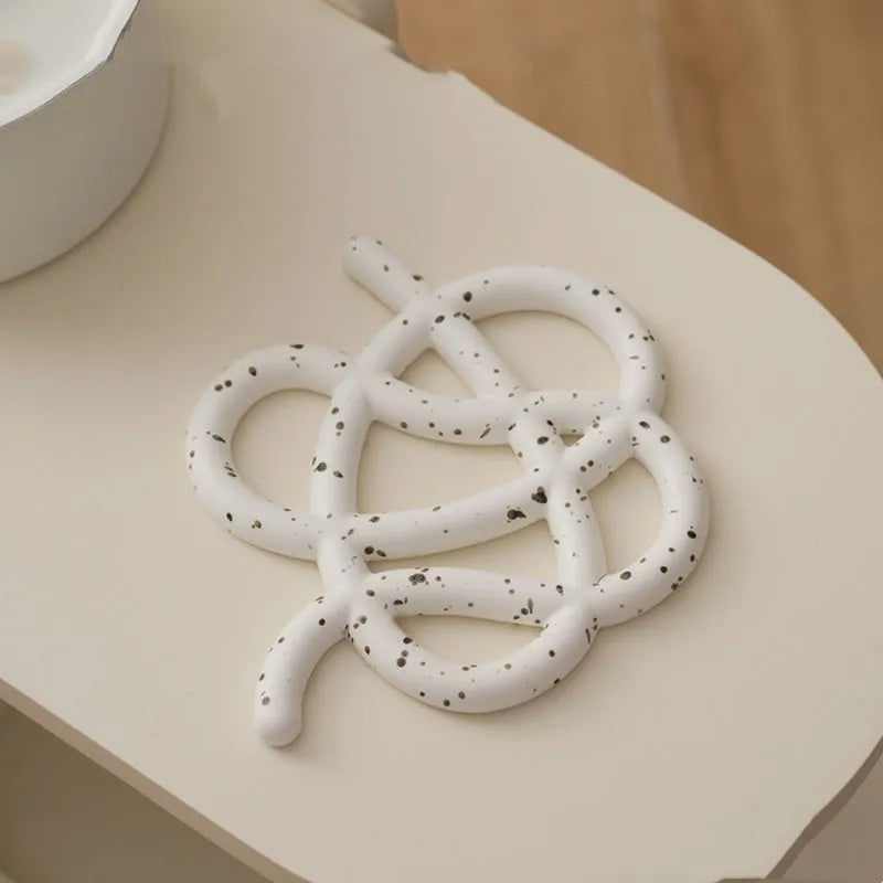 Ceramic heat-resistant pot mat in irregular shape with non-slip silicone pads