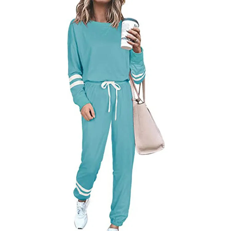 Women's plus size loose-fitting casual suit set in a solid colour with half-length sleeves.