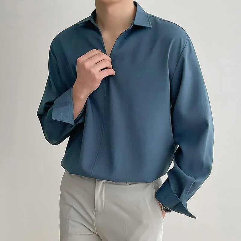 Men's loose lapel long sleeve shirt in a solid colour on a hanger.