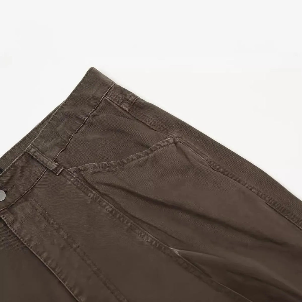 Men's brown straight-leg cotton trousers showing high-waist design and traditional straight-leg silhouette