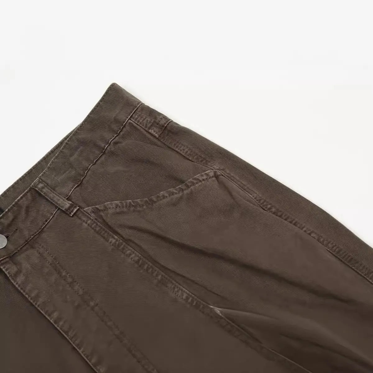 Men's brown straight-leg cotton trousers showing high-waist design and traditional straight-leg silhouette