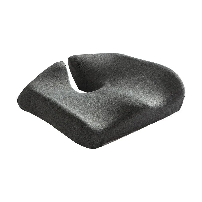 Dark grey memory foam office chair cushion with lumbar support, shown on a black desk chair.