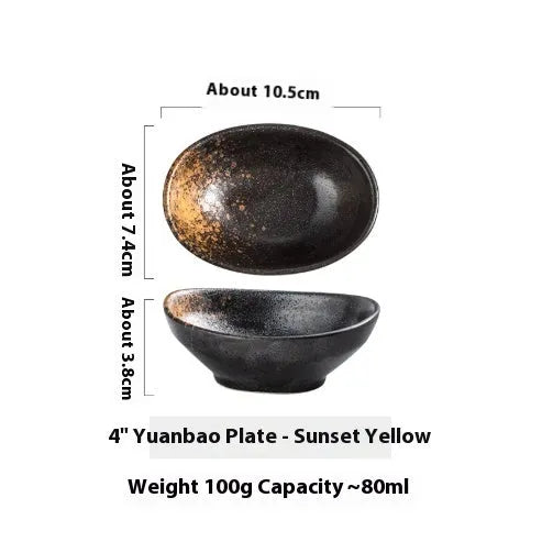 Oval Japanese ceramic sauce dipping bowl with traditional underglaze pattern on a wooden table.