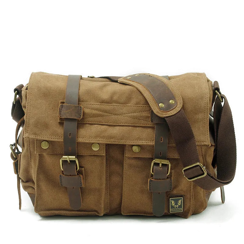 Men's brown canvas crossbody shoulder bag with leather trim shown open, revealing internal organiser pockets.