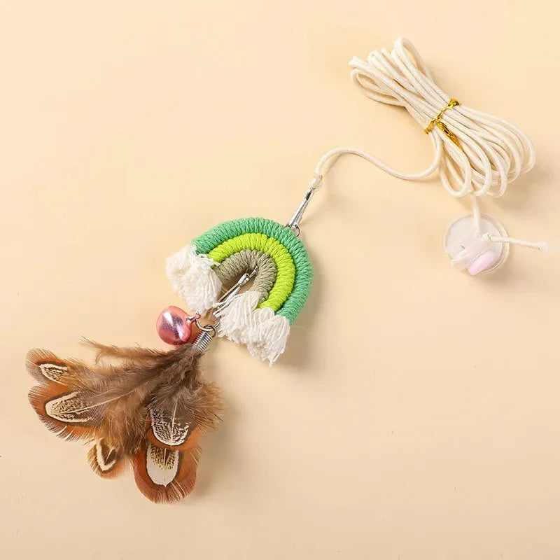 Blue feather cat toy hanging from door with elastic rope and sticky buckle clamp for interactive play