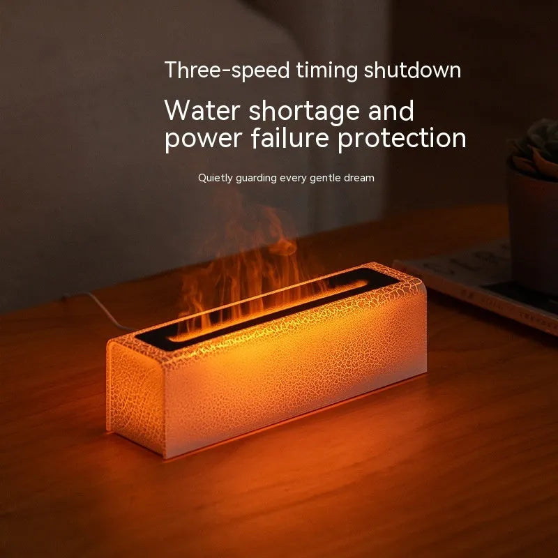 Square-shaped lava lamp-style USB aroma diffuser humidifier with colourful flame light effect on a desk.