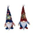 Two red and white faceless cloth baby doll ornaments for Christmas display or use as candy bags.