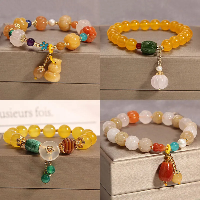 Khaki crystal bead bracelet on an adjustable gold silk cord.