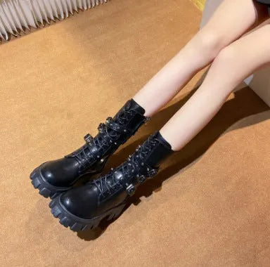 Black women's mid-calf buckle boots with side zip and round toe on a white background.
