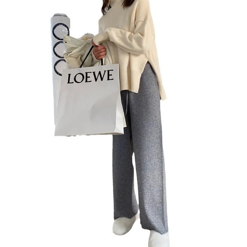 Women's high waist knitted wide-leg trousers in cream white colour with dropped mopping style