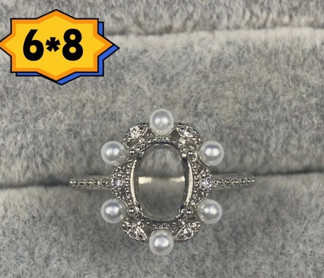 Oval denier ring ornament with 6x8mm stone, open mouth design, and five-pointed star detail