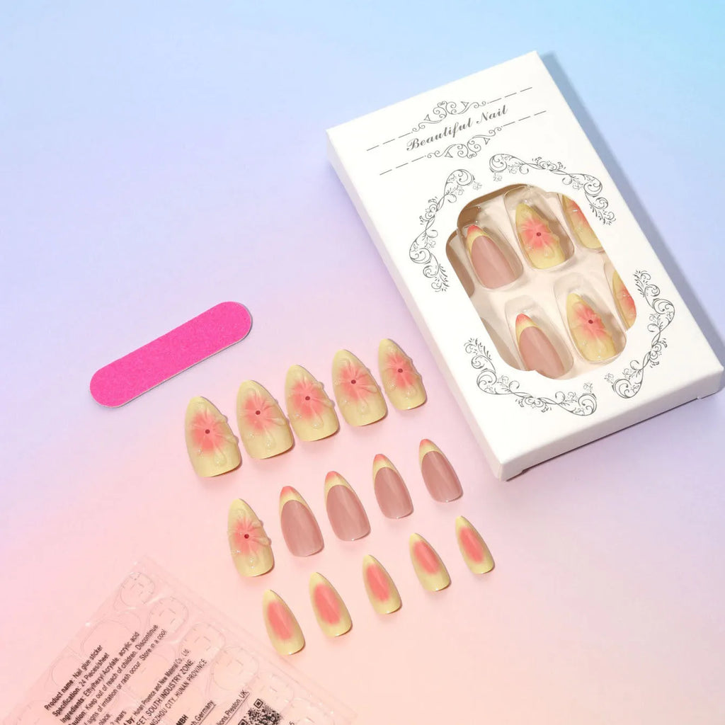 Fake nails set with white plastic armour pieces featuring raised pink and green cartoon flower designs.