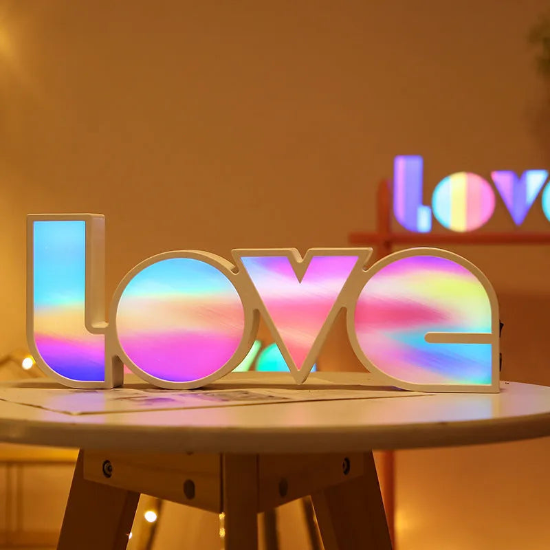 Rainbow style LED LOVE decorative light on a tabletop