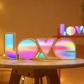 Rainbow style LED LOVE decorative light on a tabletop