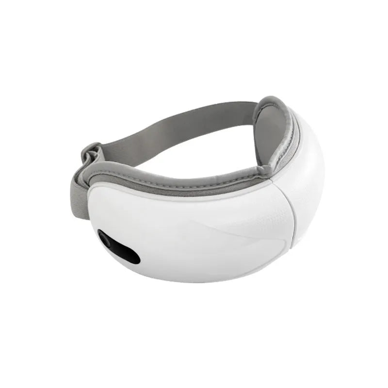 White rechargeable eye massager with airbag massage and hot compress functions on a plain background.