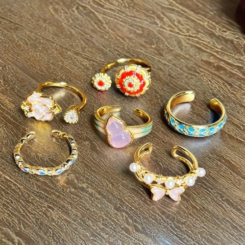 Adjustable copper women's ring with vintage oil drip finish, gourd shape, and inlaid zircon stones in floral and bow designs.