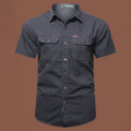 Men's short sleeve cotton work shirt in loose fit cardigan style with non-ironing treatment