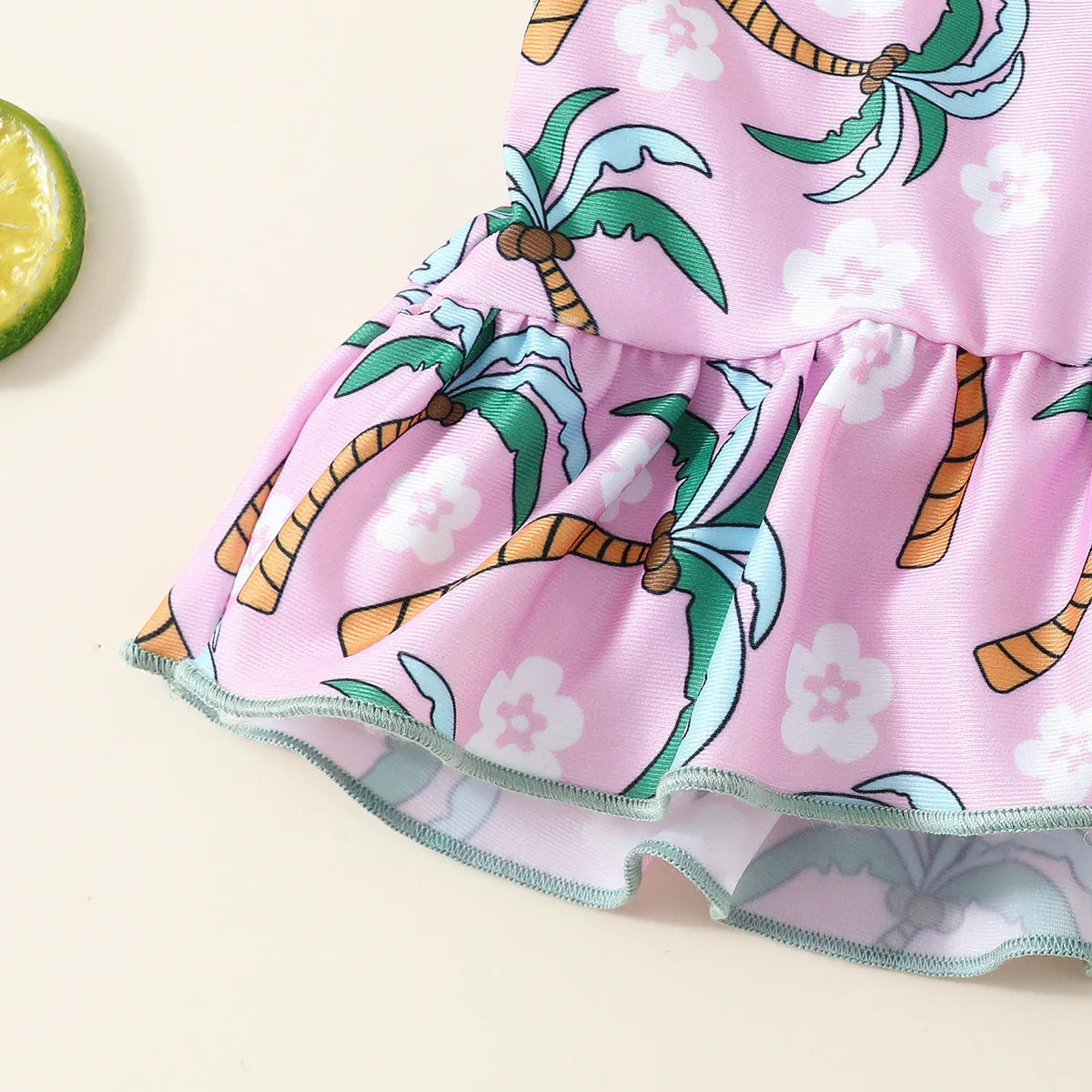 White children's two-piece polyester swimsuit set with top and shorts on a hanger.
