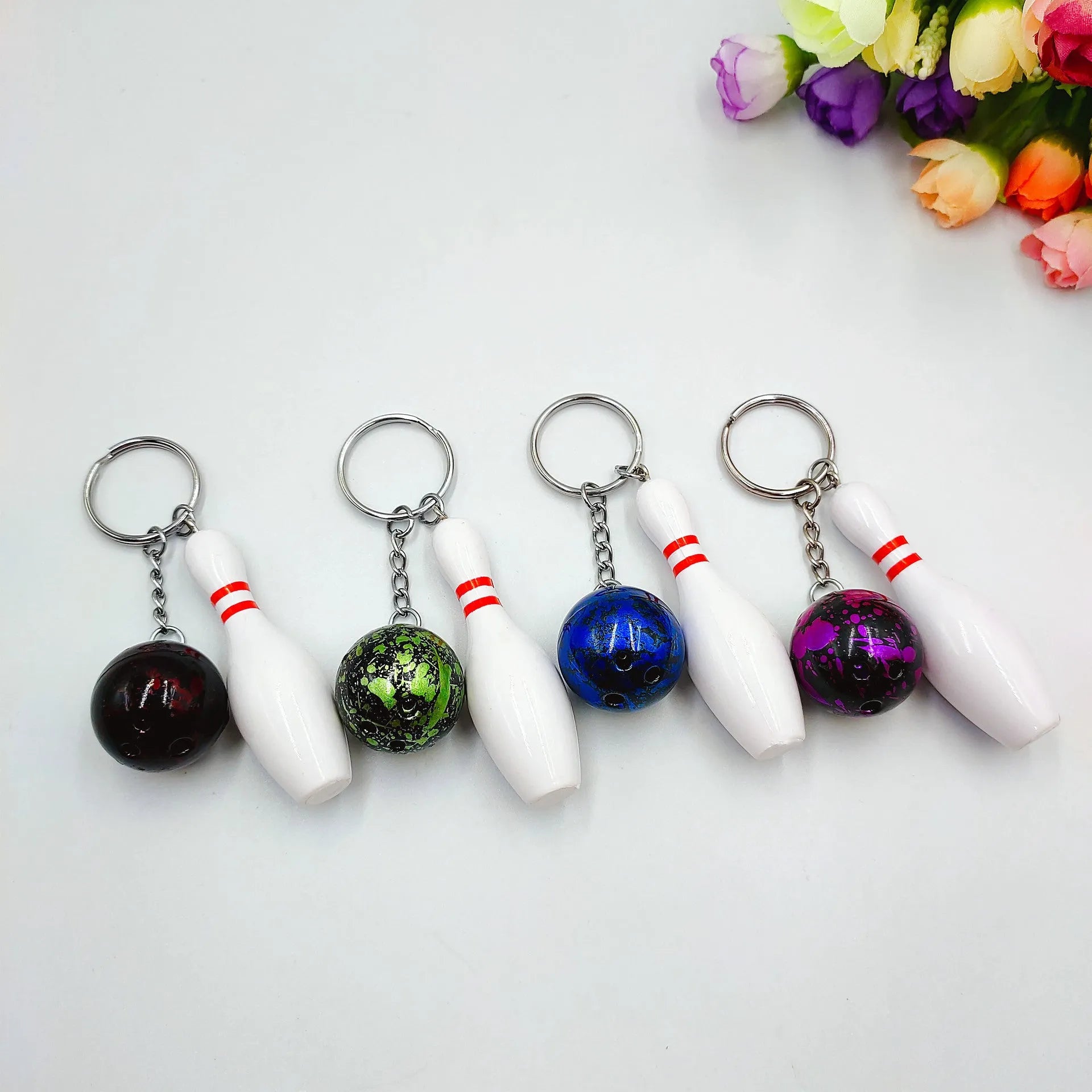 Mini bowling pin keychain pendant in PVC metal available in four colours