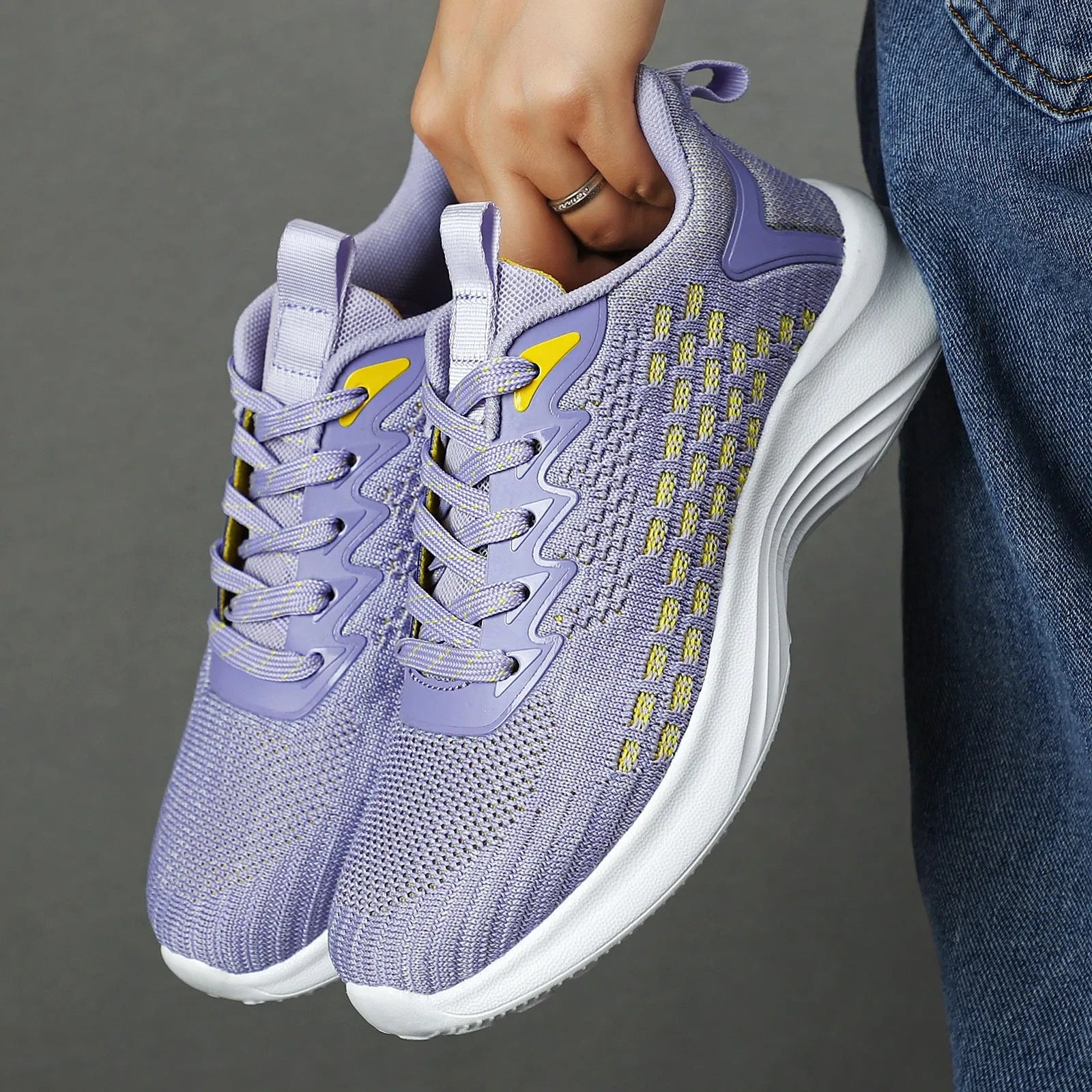 Women's lavender purple flyknit running shoes with mesh lining and striped pattern