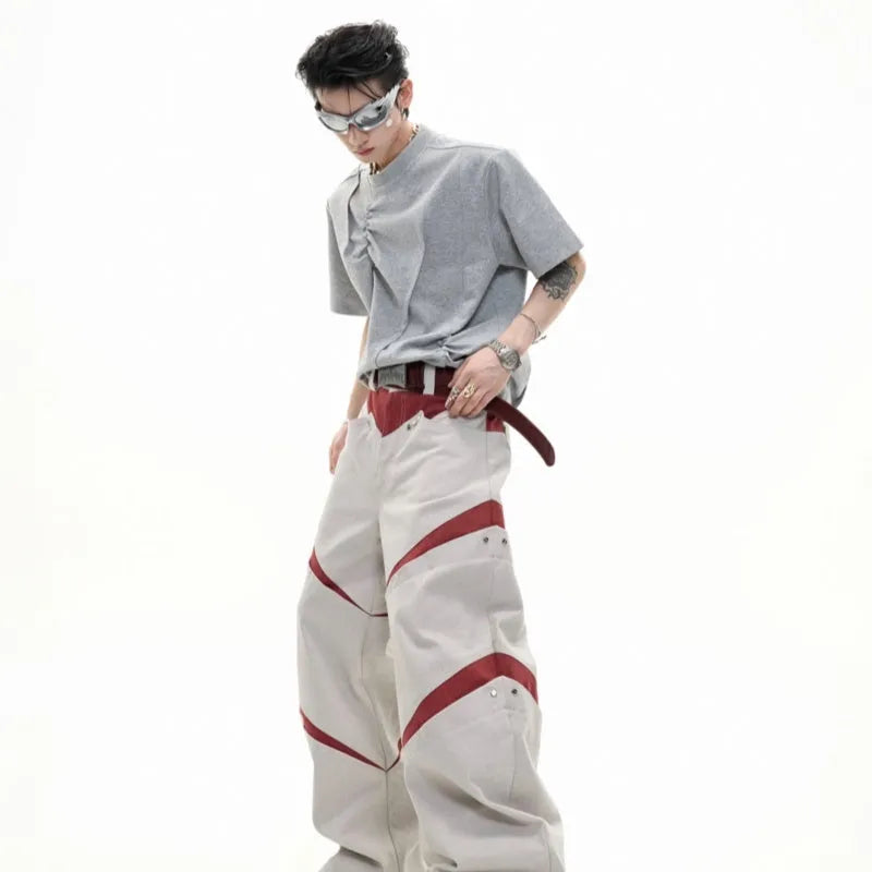 Men's loose grey cotton T-shirt with pleated detail and round neck.