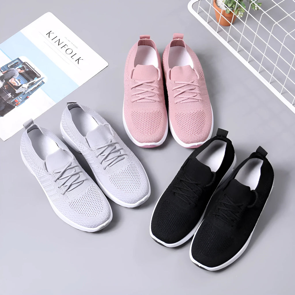 Women's black mesh sneakers with soft sole and round toe on a white background