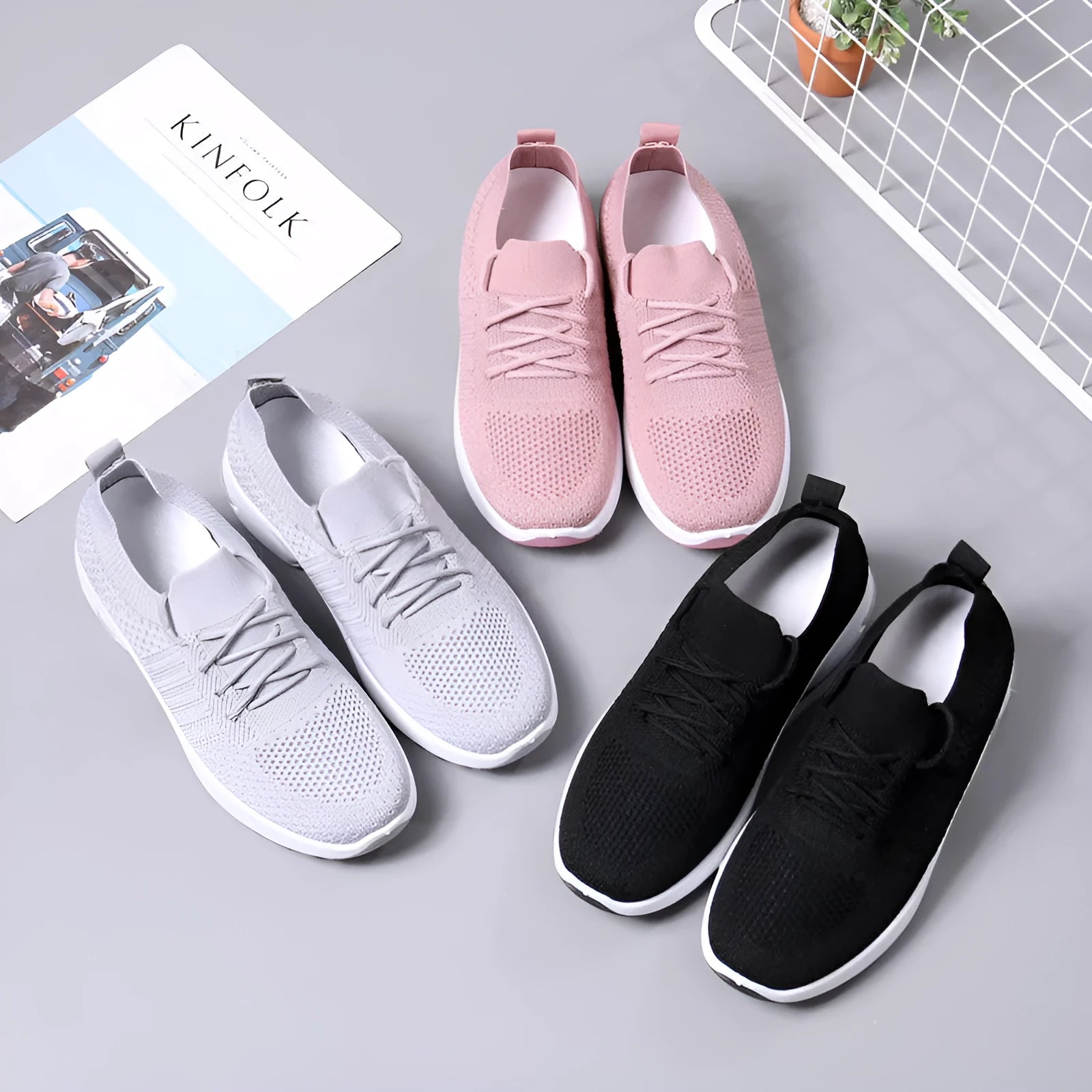 Women's black mesh sneakers with soft sole and round toe on a white background