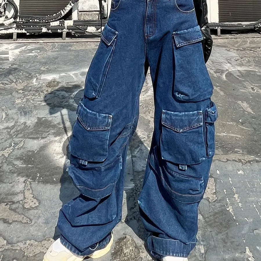 Dark blue distressed wide-leg jeans with a high waist and multiple pockets on a mannequin.