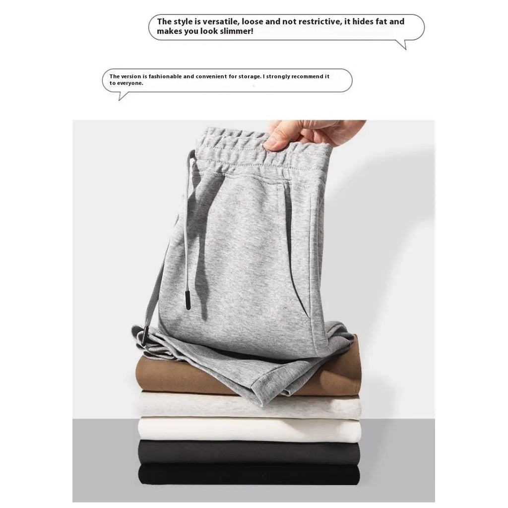 Men's and women's straight-leg cotton sports shorts in fifth length on a neutral background