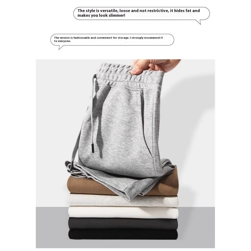 Men's and women's straight-leg cotton sports shorts in fifth length on a neutral background