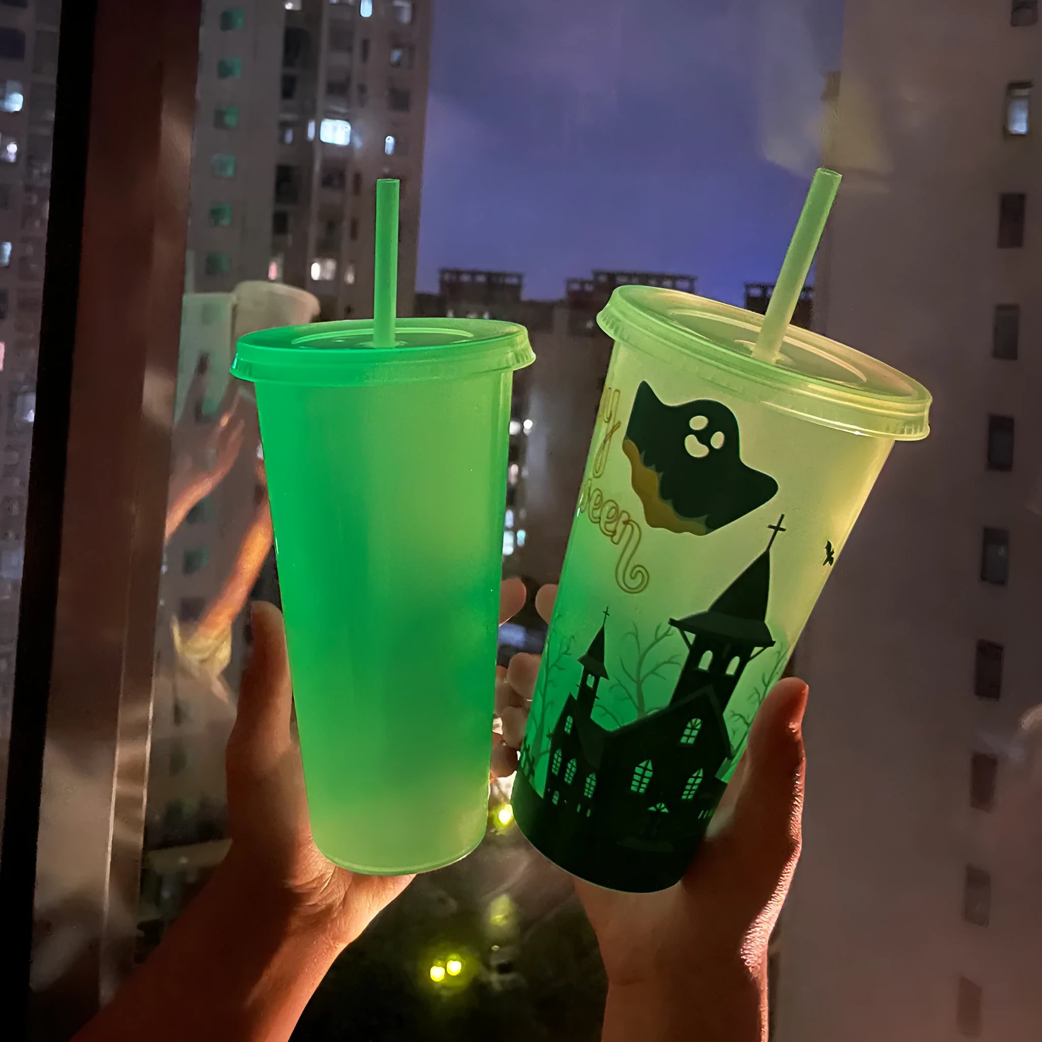 720ml luminous Halloween plastic sippy cup with straw showing cylindrical shape and colourful design