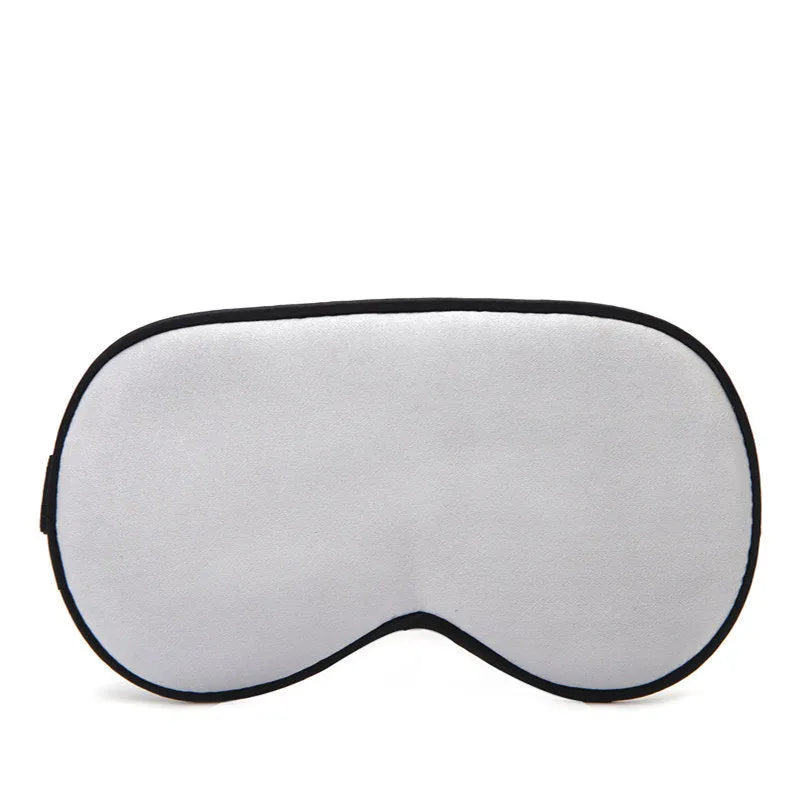 Double-sided mulberry silk eye mask in champagne colour with embroidered print.